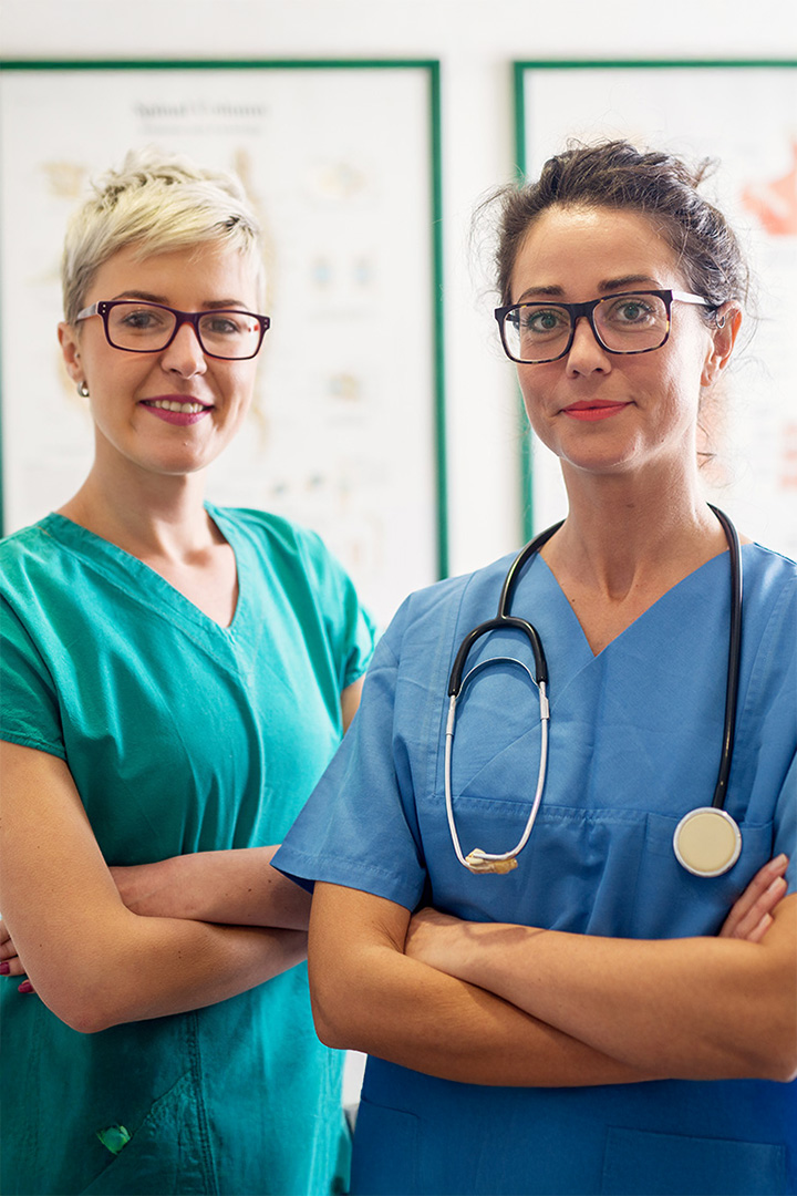 Two nurses standing side by side