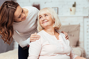 yolo-300x200-50 Nurse checking in a patient at home.